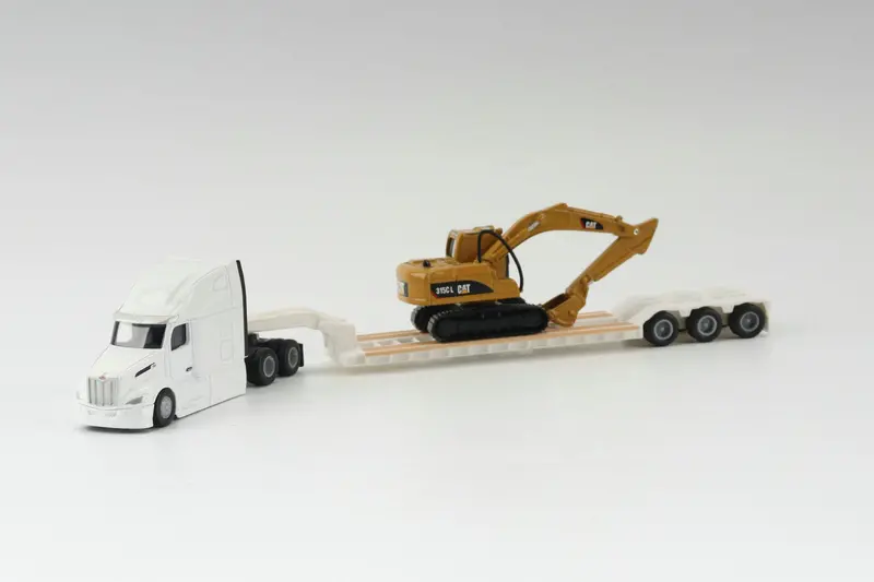 White Peterbilt 579 Tractor With Lowboy Trailer Cat 351C Excavator (Ho Scale) 1
